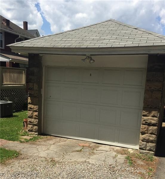 One car garage off alley.