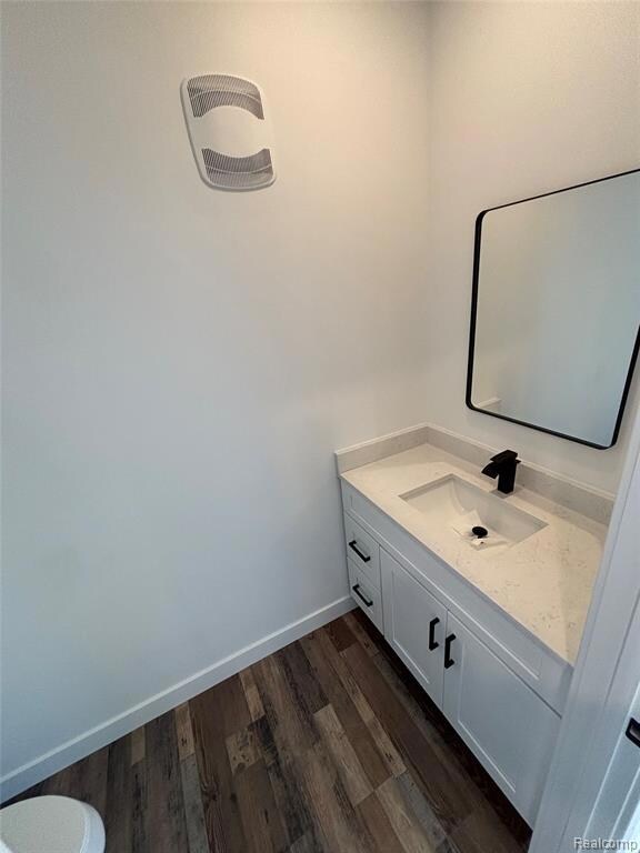 Bathroom with vanity and dark wood finished floors