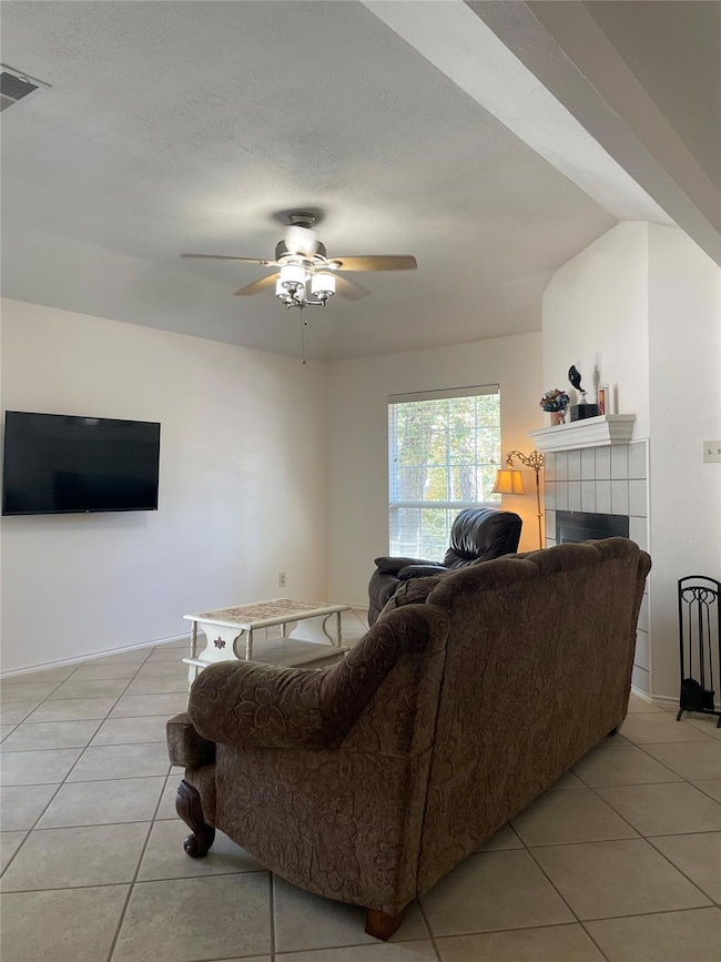 Living area featuring light tile patterned floors