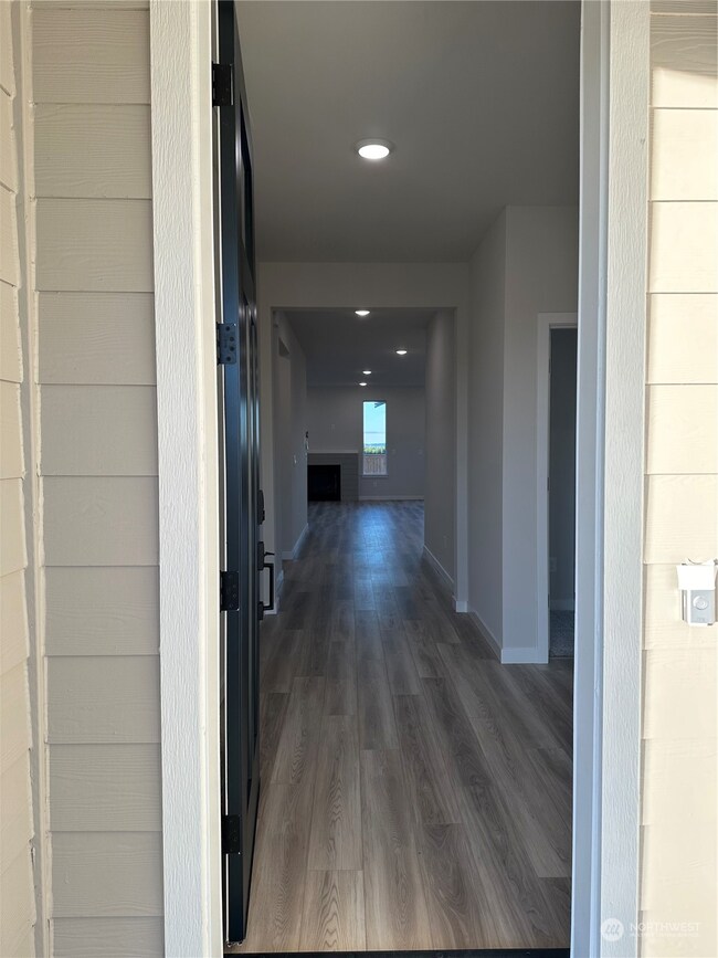 Entry to Aurora (8 foot entry door) Disclaimer: These photos are of another Aurora Home in community. Depictions of home, layout, location or other features, colors and color scheme, materials, fixtures, etc. are for showing purposes only and may not be included in the purchase price and availability may vary.