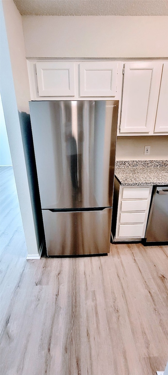 Featuring sleek stainless steel appliances and mod