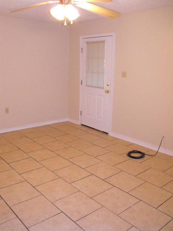 Front entry into the living room with tile floors