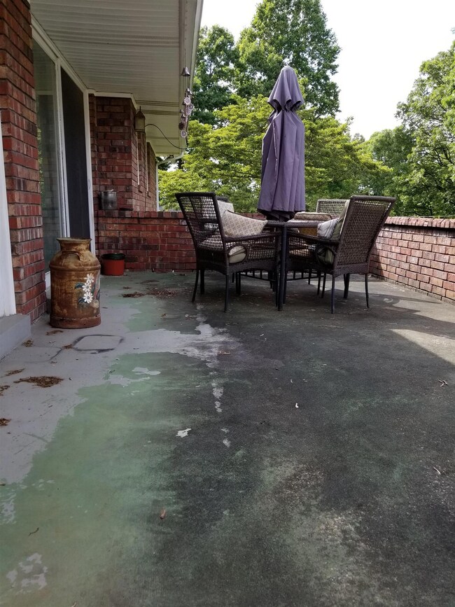 Spacious patio area in back of home perfect for entertaining. Enters off kitchen and dining area.