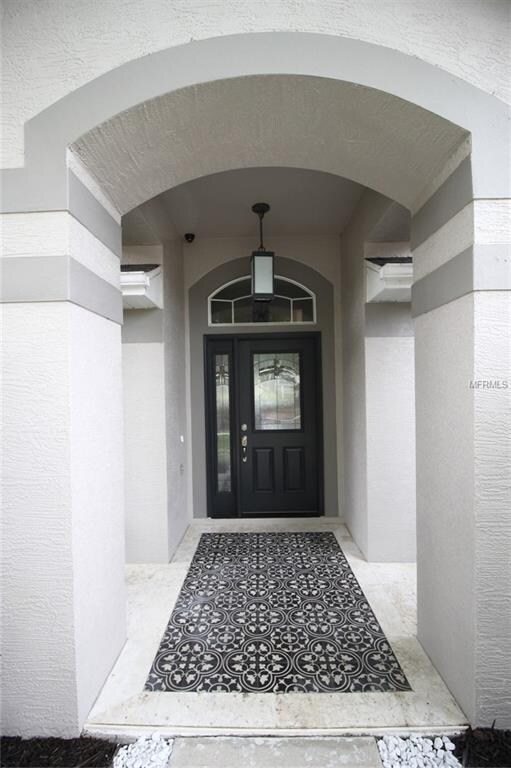 Front Porch with travertine and cement tile floor