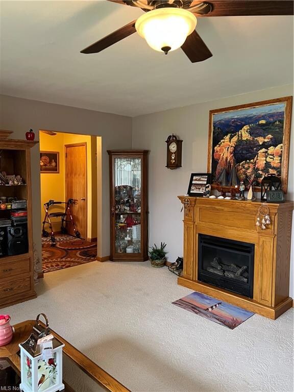 Living room 19 x 15 with ceiling fan.  Gas Firepla