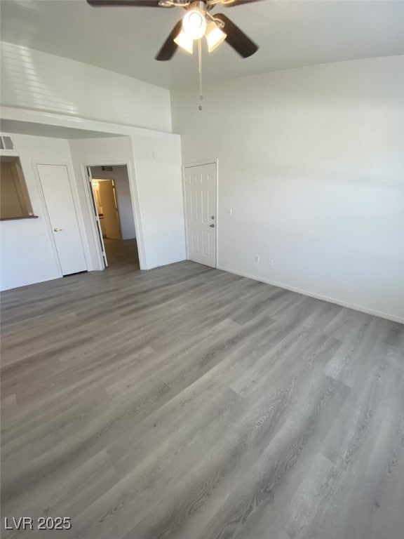 Unfurnished bedroom featuring wood finished floors and ceiling fan