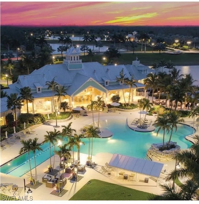 Resort Style pool with a patio bar and Restaurant