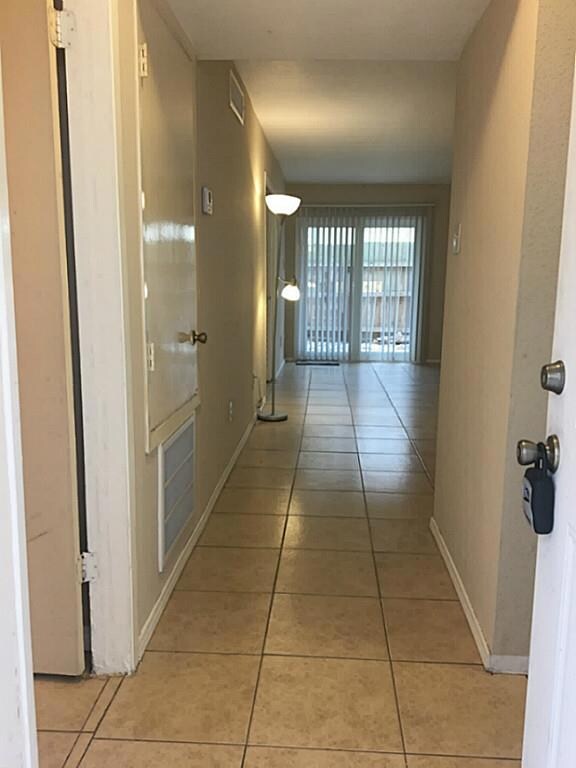 Open front door you will see the well kept, nice and clean tile flooring