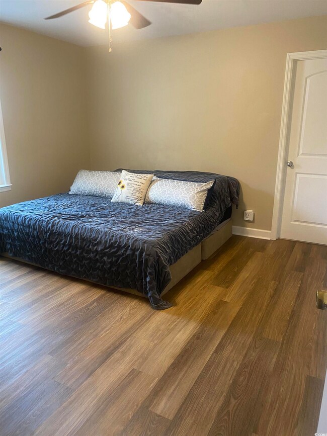 Bedroom featuring hardwood / wood-style flooring a