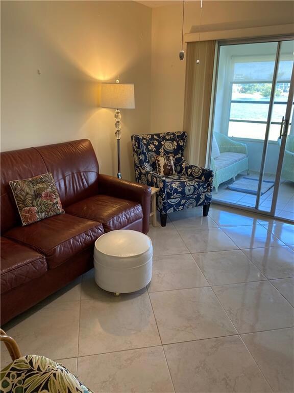 Guest room has sofa bed and tv.
