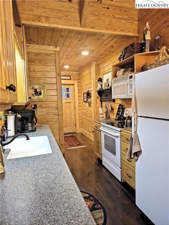 Kitchen looking back toward laundry room on left and entry door