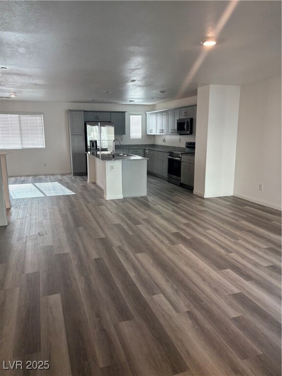 Kitchen with range, refrigerator, dark wood-style
