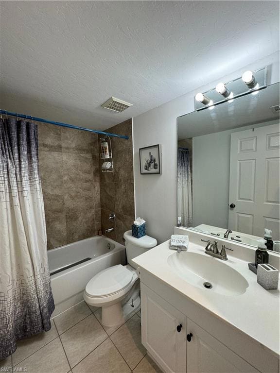Bathroom featuring visible vents, toilet, tile pat