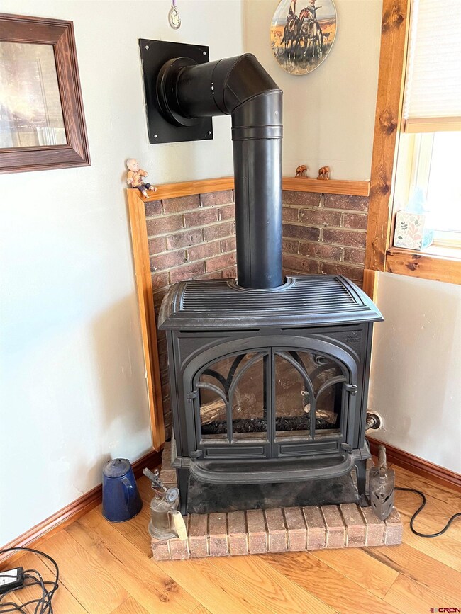 With 2 forms of heat. Wood burning stove and propane stove with thermostat.
