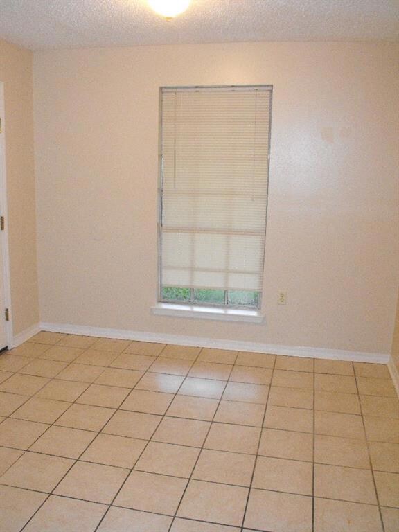 Dining area which opens into the kitchen, door to