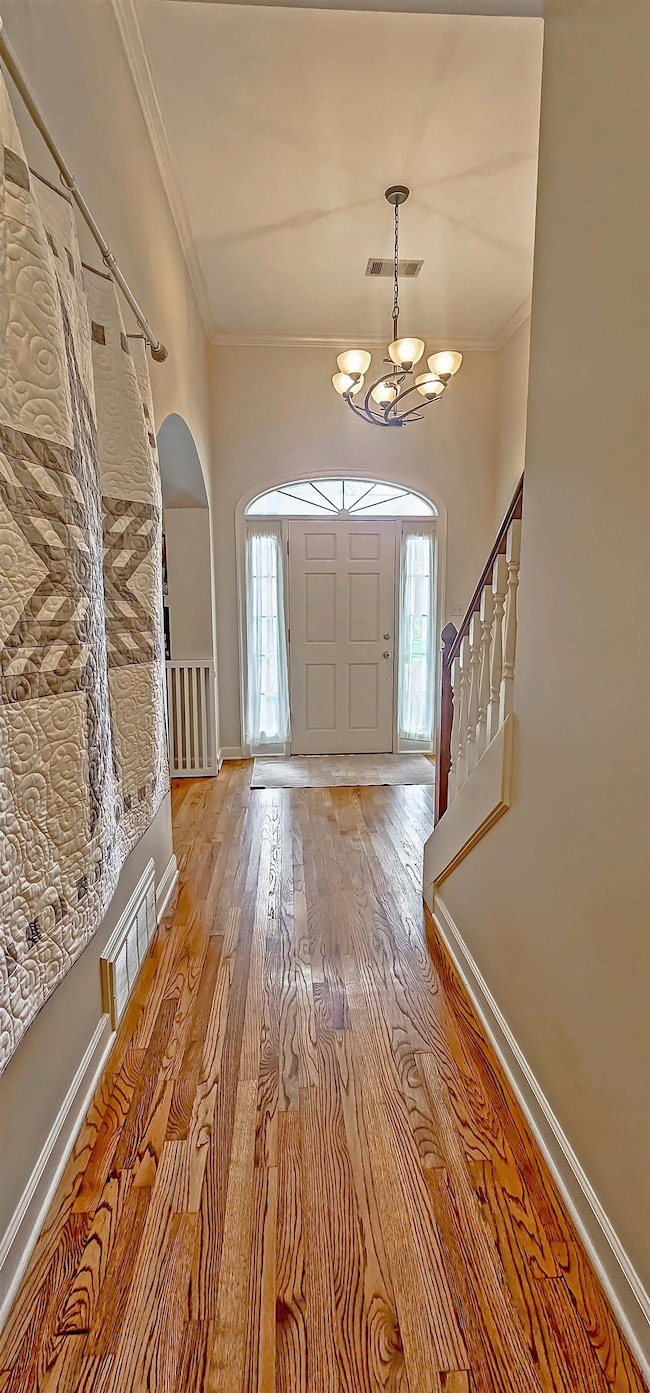 Bright entry w/ gleaming hardwoods &  high, smooth ceilings.  You'll love the flow of floor plan.