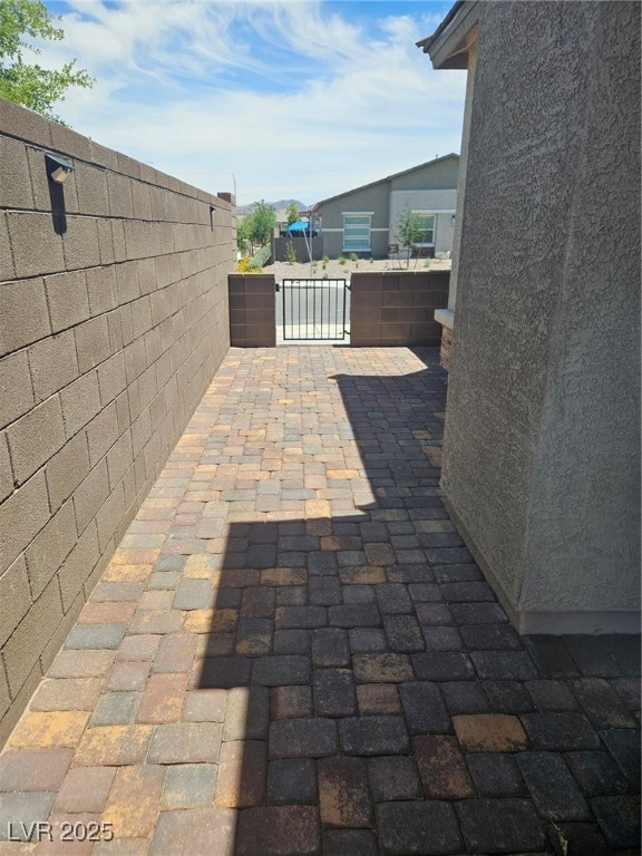 View of patio / terrace featuring a gate