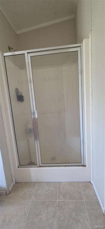 Bathroom featuring a stall shower and tile patterned floors