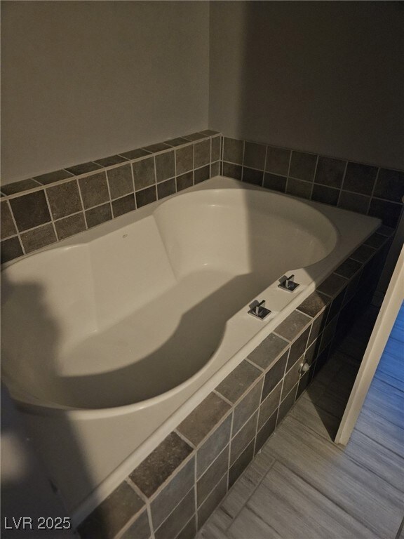 Full bathroom with a bath