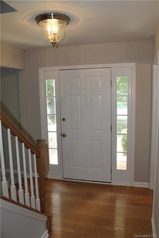 In The Entrance Are Side-Lights & Hardwoods