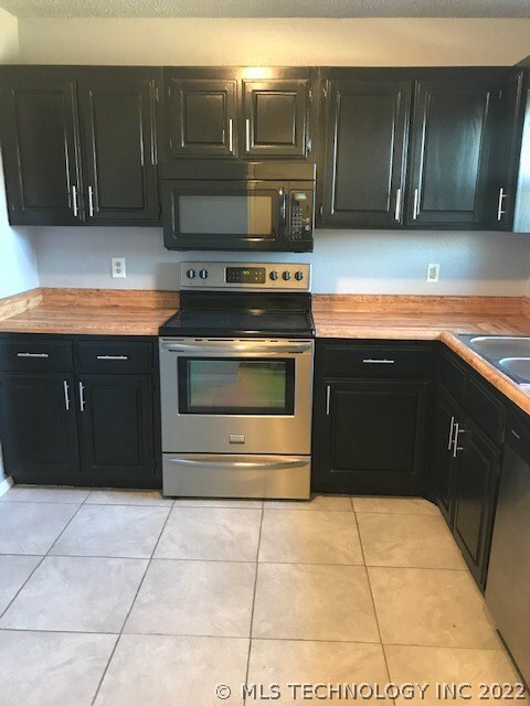 Freshly painted cabinets, tile flooring and built