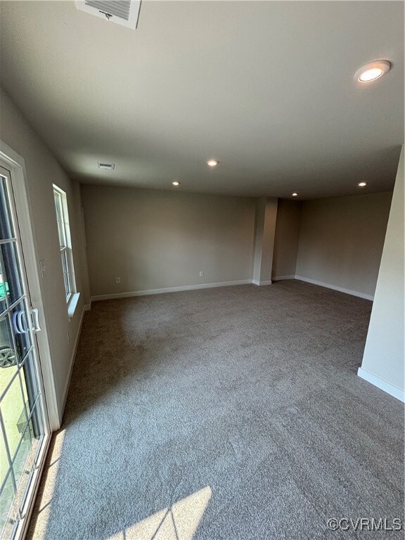 Unfurnished room featuring carpet floors and recessed lighting