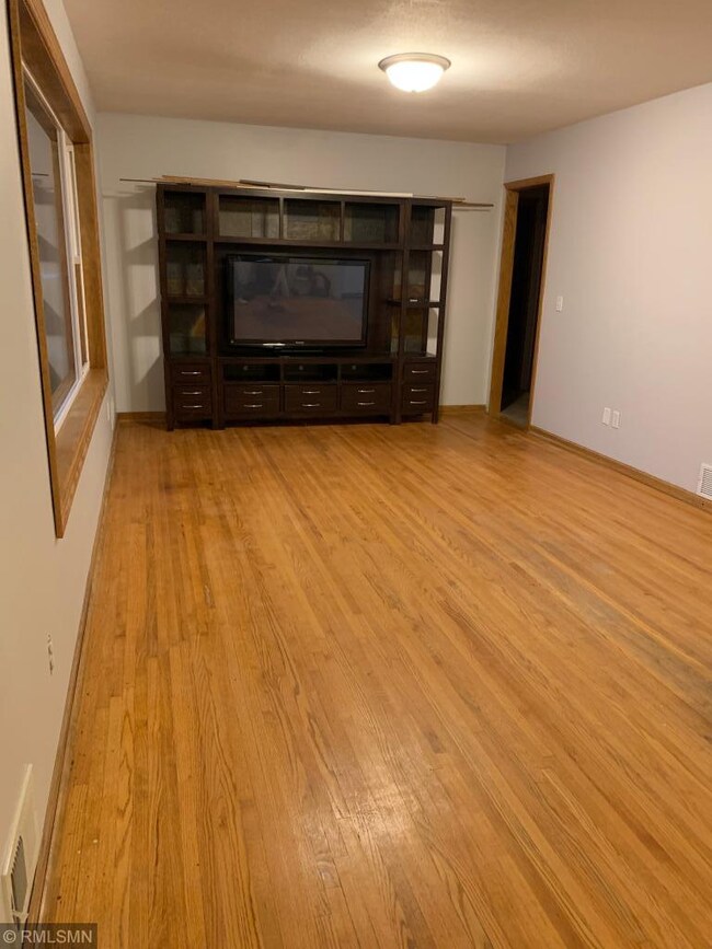 HANDSOME OAK HARDWOOD FLOORS ARE ALWAYS A NICE PLU