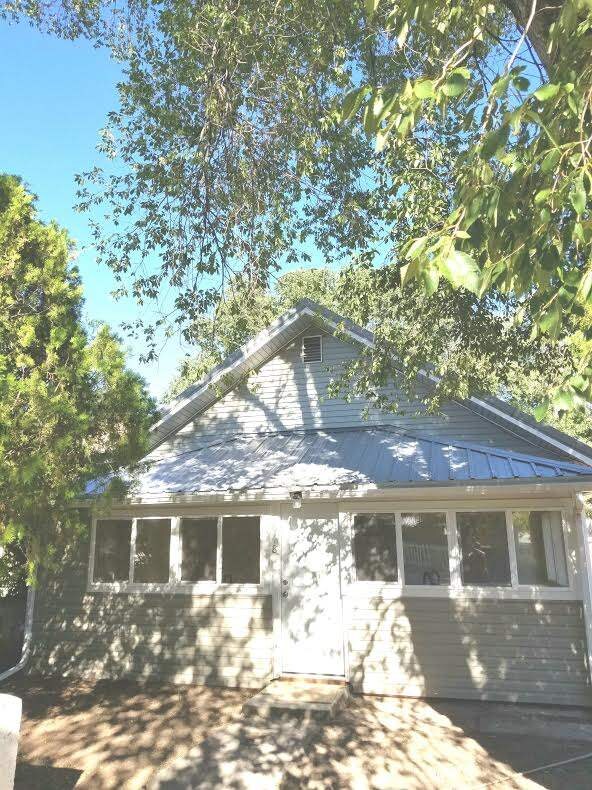 Tiled porch with storage closet, new windows and s