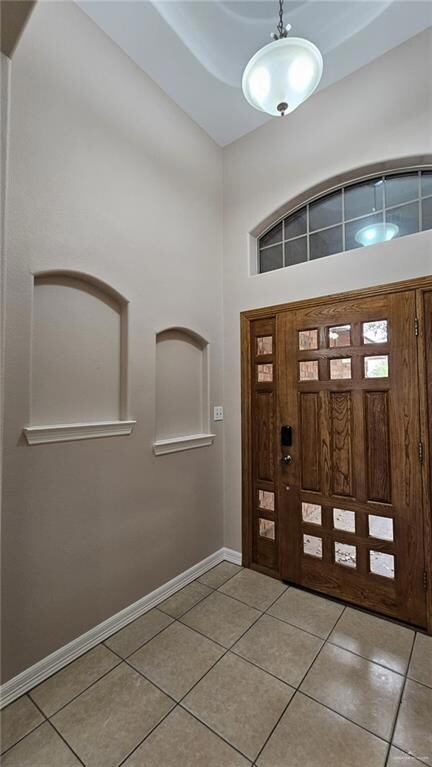 Foyer entrance with tile floors
