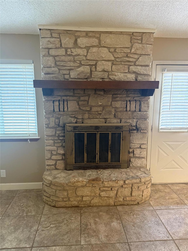 Stone wood burning fireplace with glass doors