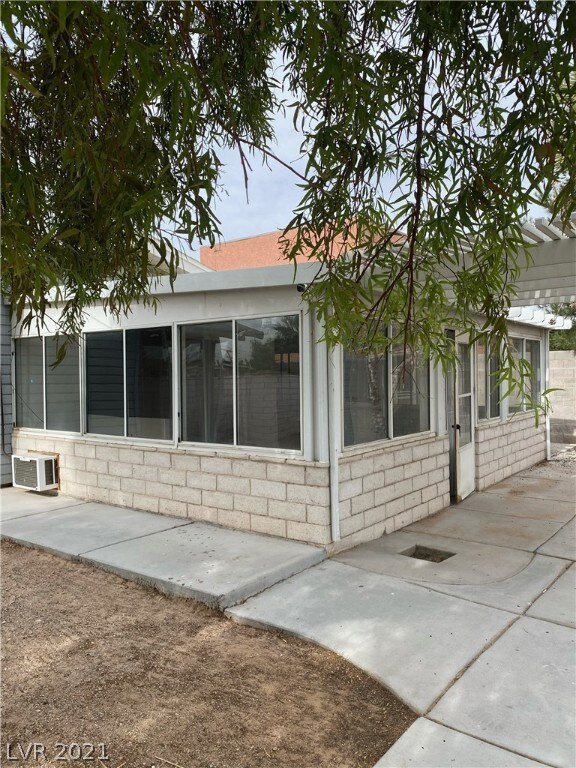 Rear enclosed patio. currently used as bedroom 3