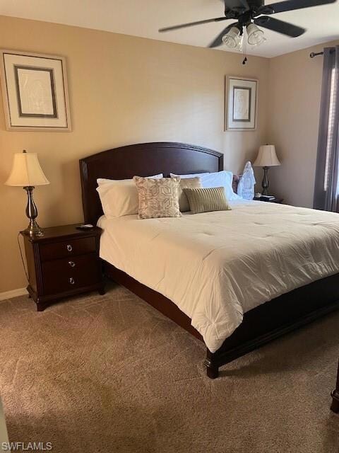 Carpeted bedroom featuring baseboards and a ceilin