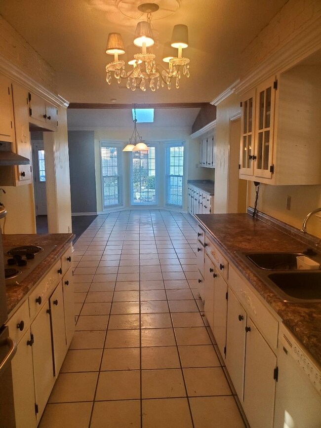 Kitchen featuring sink, hanging light fixtures, co