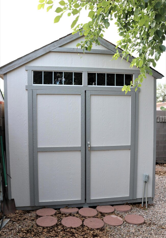 Shed Conveys. Electricity to Shed