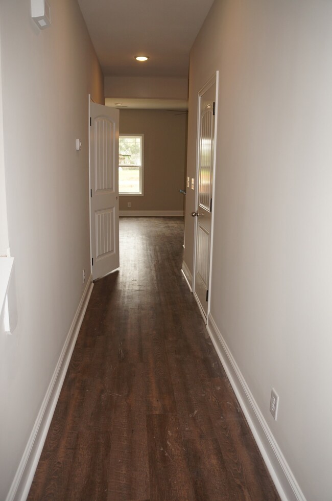 Hallway coming in from the Front Door leads back to the Kitchen and Great Room.
