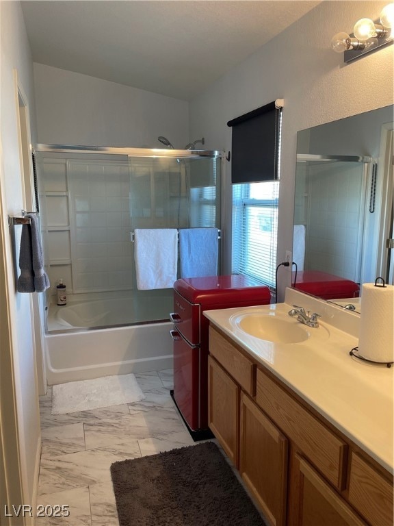Full bathroom with marble look tile flooring, vani
