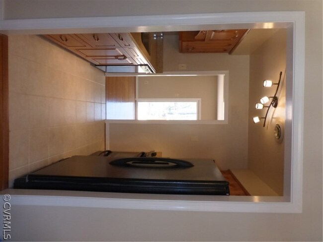 Renovated kitchen with ceramic tile floor, granite