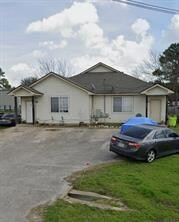 Ranch-style home with a front yard