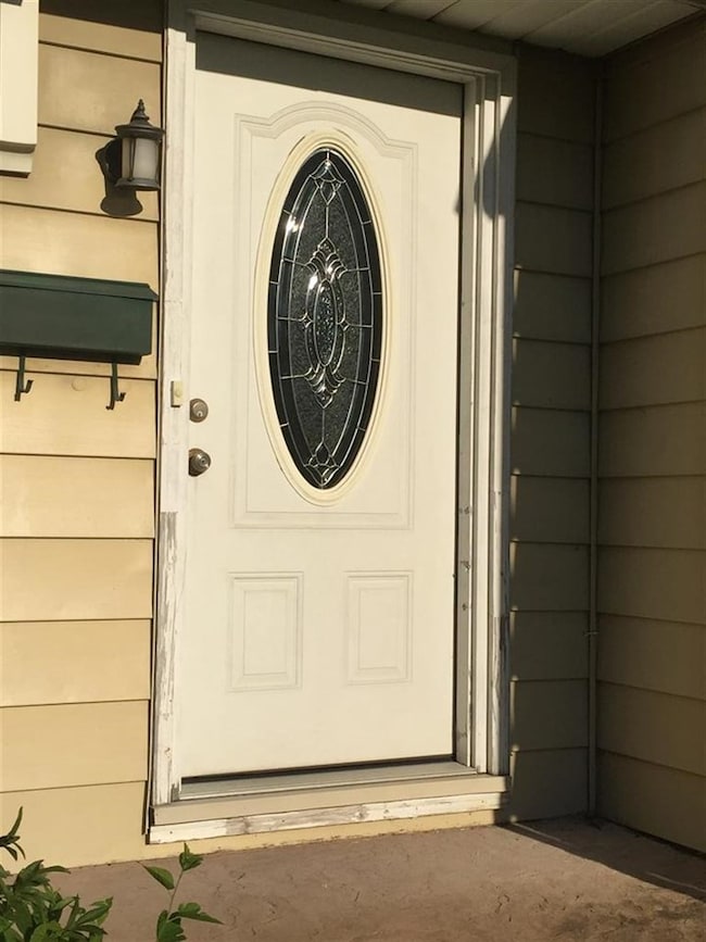 Updated leaded glass door upon entry.