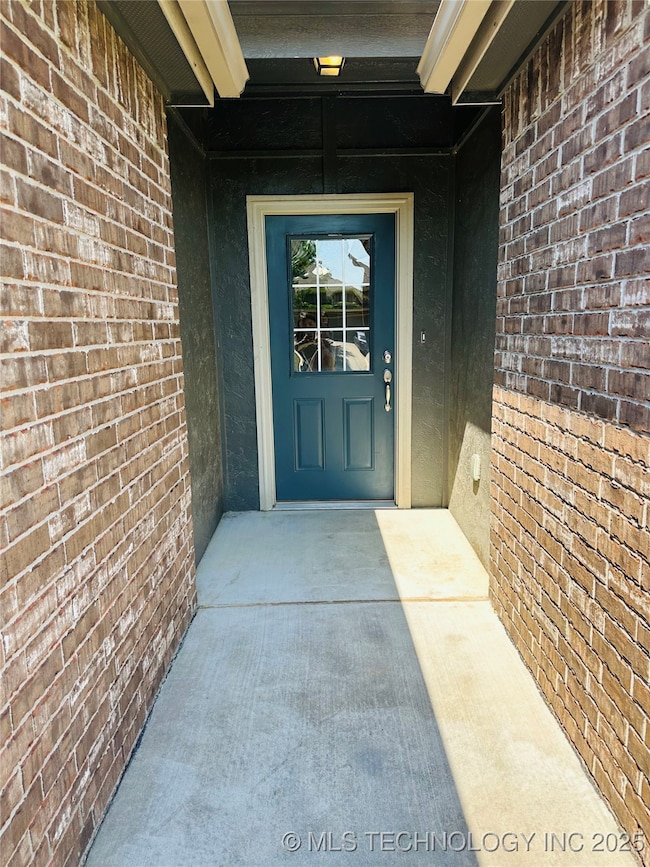 Property entrance with brick siding