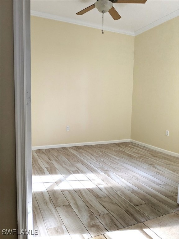 Empty room featuring baseboards, ornamental moldin