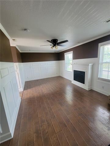 Exquisite master bedroom with fireplace and crown 