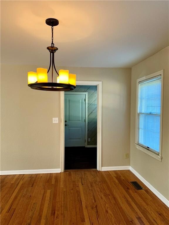 Dining area looks into office /flex room and garag