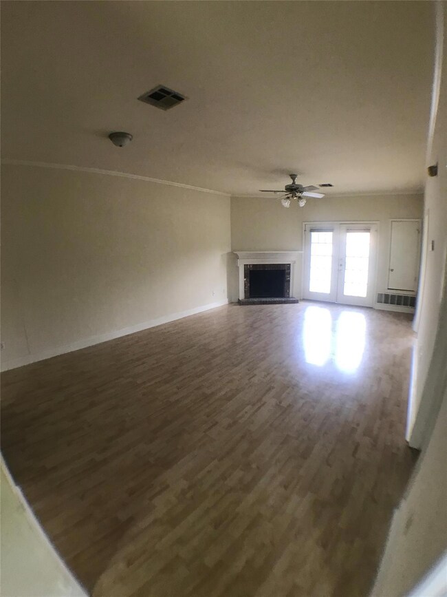 Unfurnished living room featuring visible vents, 