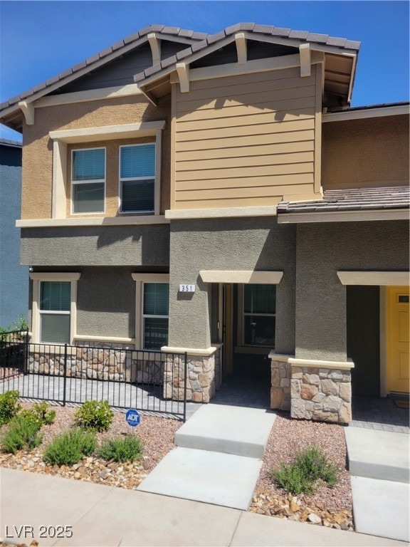 View of front facade featuring stucco siding, cove