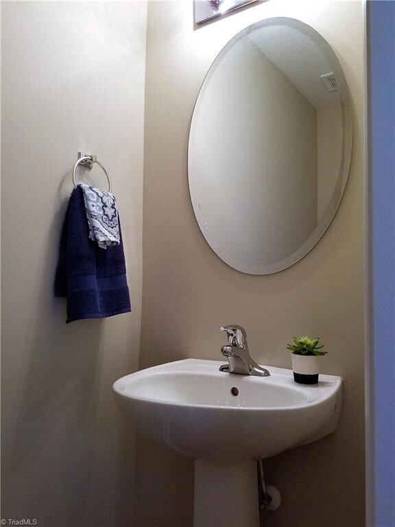 Powder Room near front door.