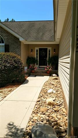 Maintenance free pebble lined walkway