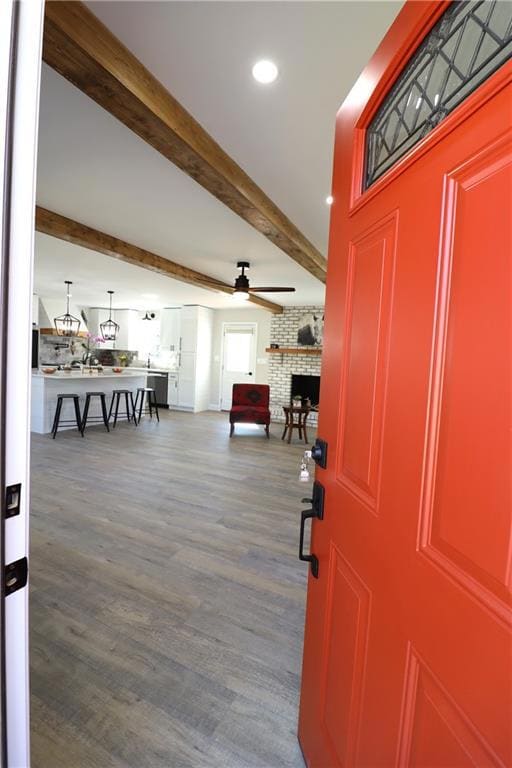 Foyer entrance with beamed ceiling, recessed light