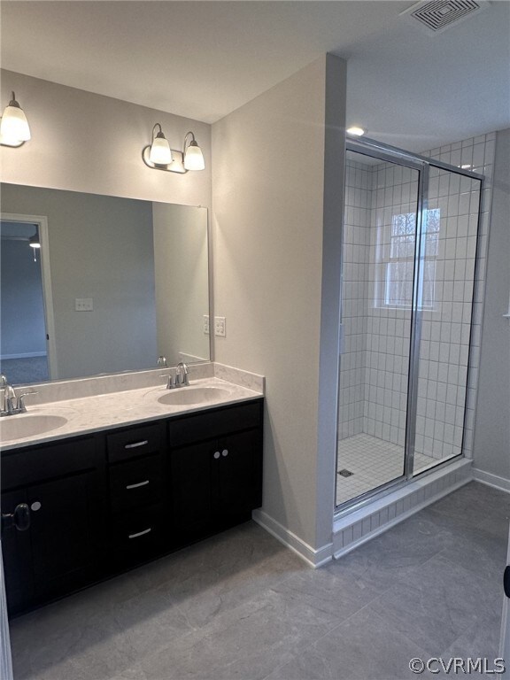 Bathroom with walk in shower, double sink vanity,