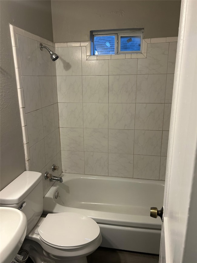 Full bathroom with toilet and shower / bathtub combination